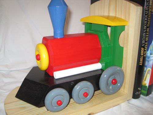 Handmade wooden childs bookcase stand in the form of a train